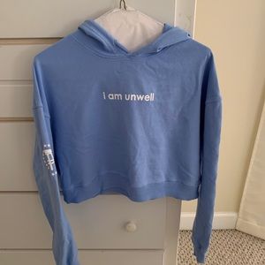 Call Her Daddy blue cropped “i am unwell” hoodie